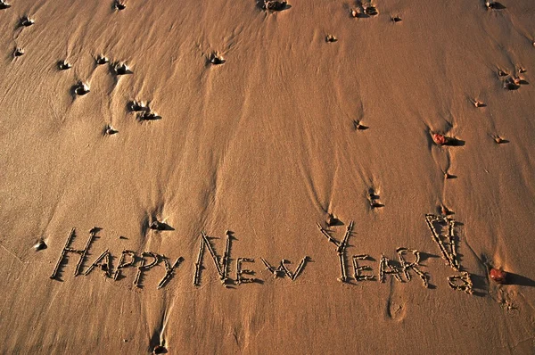 "Happy New Year "message on a beach Стоковая Картинка