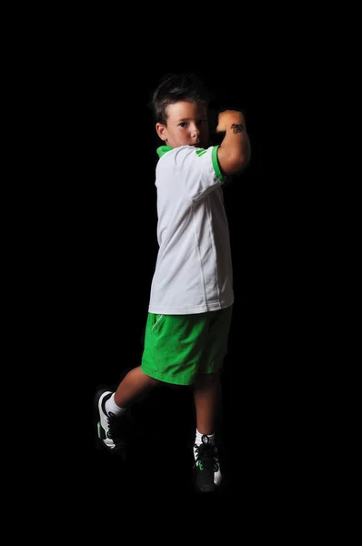 Tennis boy isolated in black — Stock Photo, Image