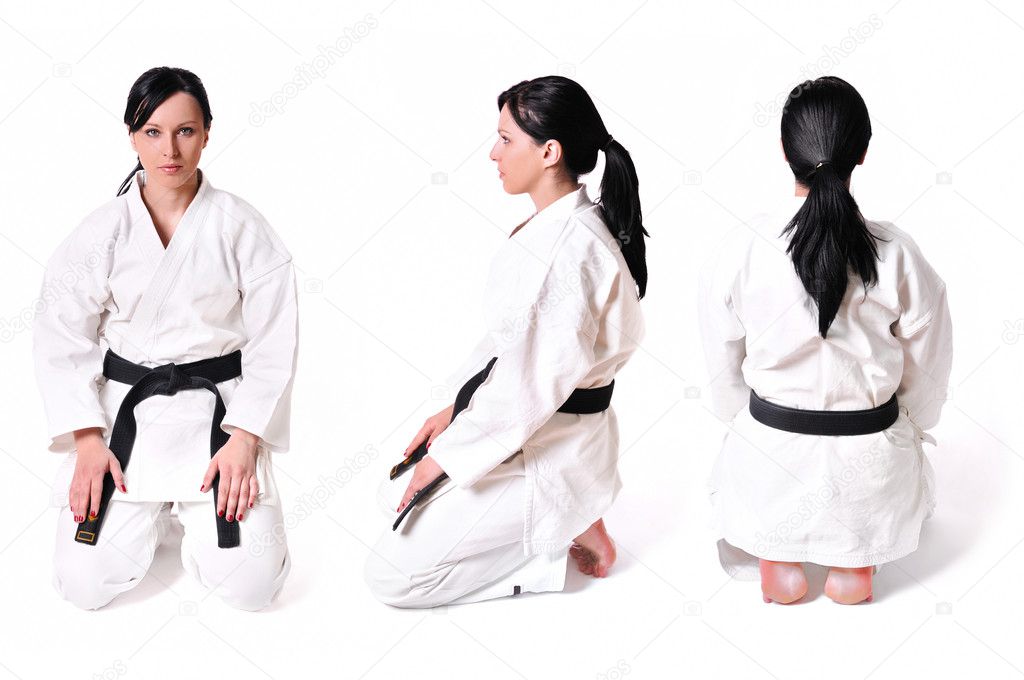 Karate woman in position isolated on white