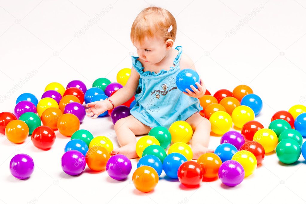 Baby girl play with balls — Stock Photo © cokacoka 6632519