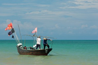 Fishing boat in sea clipart