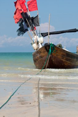 Traditional wooden fishing boat on weizhou island clipart