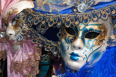 Pink and blue venetian carnival masks clipart