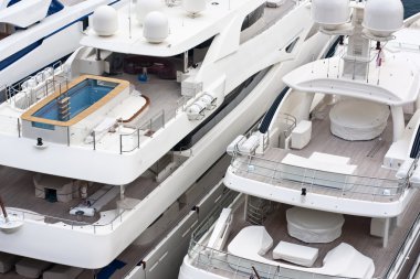 Luxurious triple deck yachts clipart