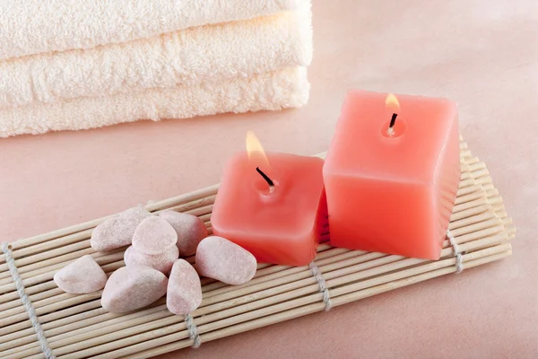 Red candles on bamboo mat — Stock Photo, Image