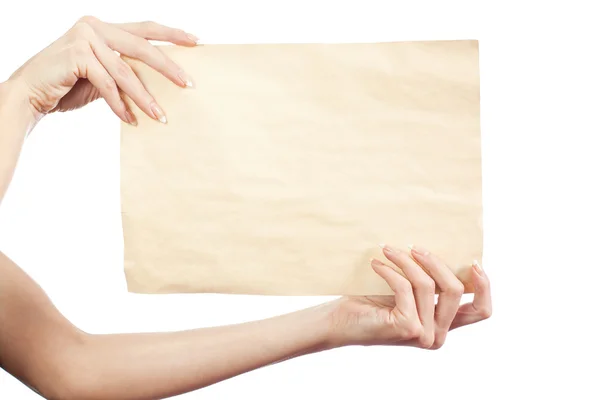 Hoja limpia de papel en manos femeninas — Foto de Stock