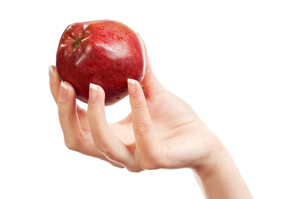Na mão das mulheres uma maçã vermelha — Fotografia de Stock