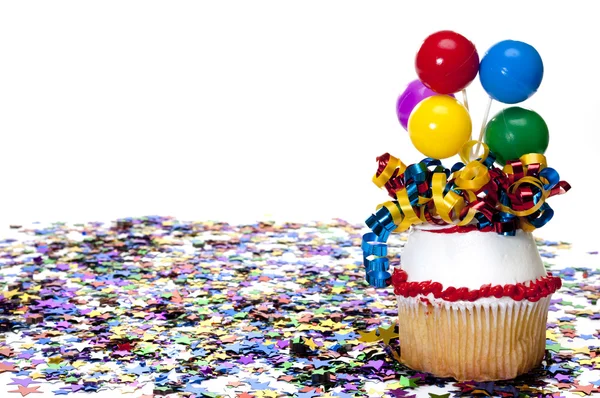 Decorated Cupcake and Confetti at Party — Stock Photo, Image