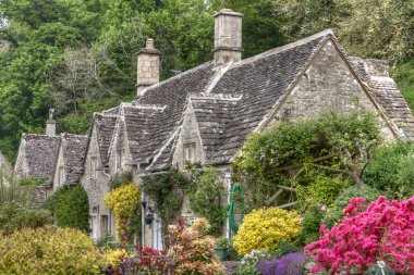 Typical Cotswolds gardens in Bibury clipart