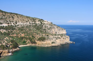 View of St Archangel Monastery from Livadi Beach clipart