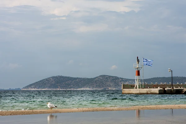 Thassos island, Greeg flag in port — Stock Photo, Image