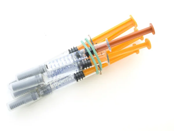 Syringes drawn by a green tape — Stock Photo, Image