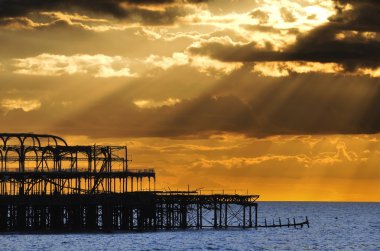 The West Pier in Brighton at sunset clipart