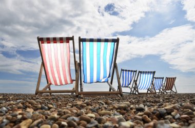 Deckchairs on Brighton beach clipart