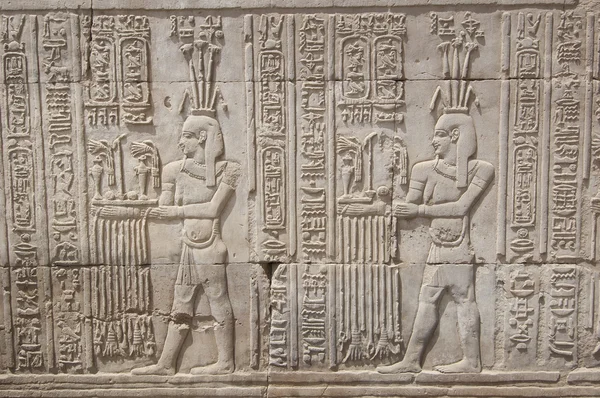 Hieroglyphic carvings on an Egyptian temple wall Stock Picture