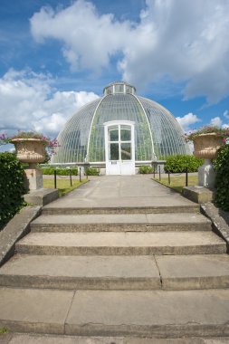 Large glasshouse in a public park clipart