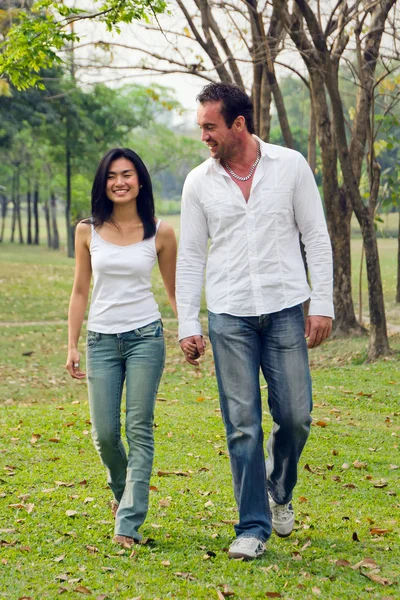 stock image Young couples walk hand in hand