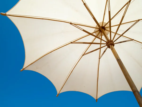 Stock image Under a white umbrella