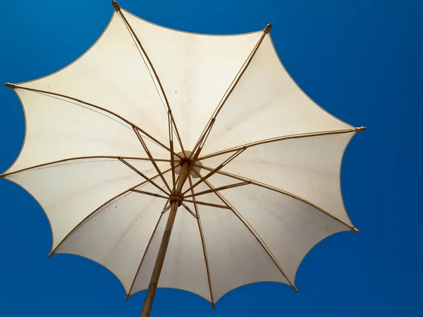 stock image Under a white bamboo umbrella