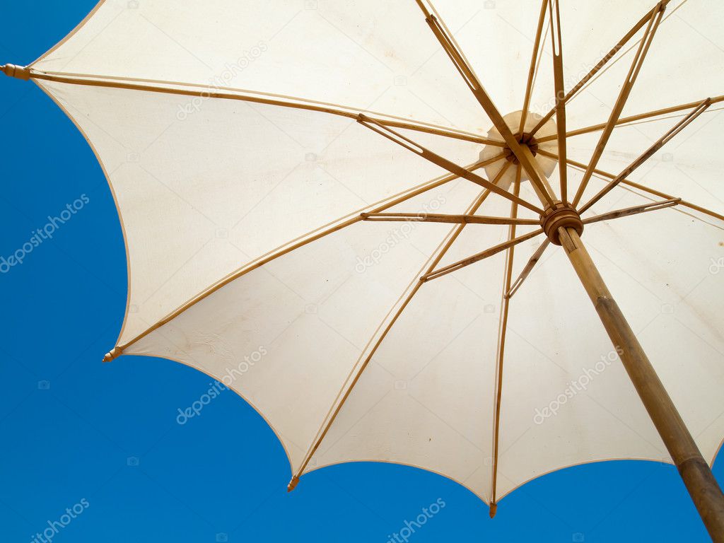 Under a white umbrella