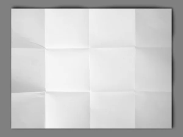 Carta bianca piegata e rugosa su sfondo grigio — Foto Stock