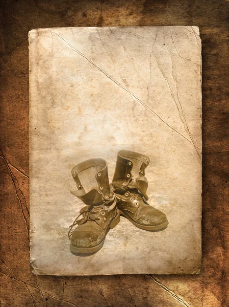 Old black top boot on paper — Stock Photo, Image