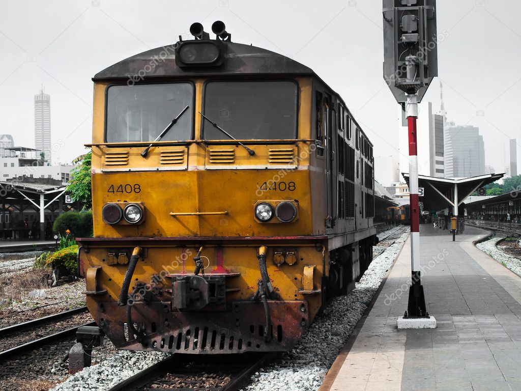 Yellow locomotive of the train
