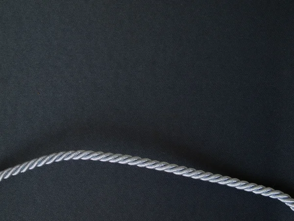 Det svarta tyget med silver rep — Stockfoto