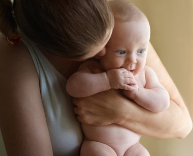 Little boy on mother hands listening her whisper clipart