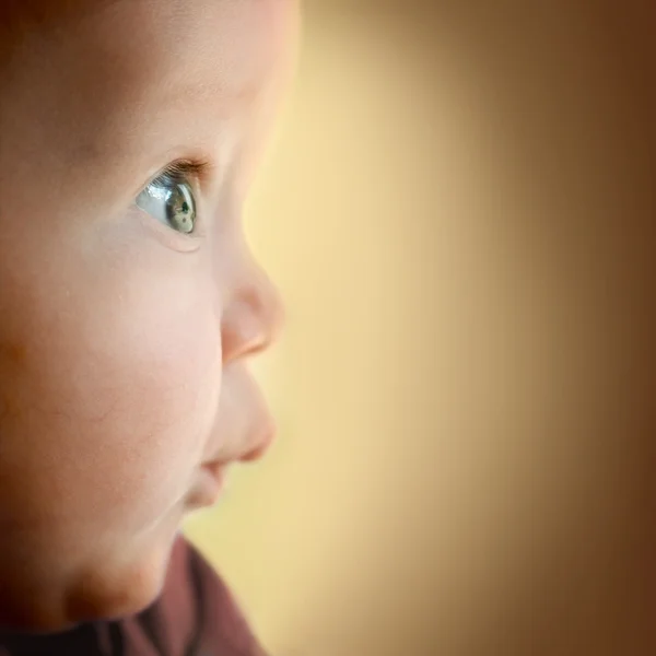 Baby boy with surprised look. Space for text. — Stock Photo, Image