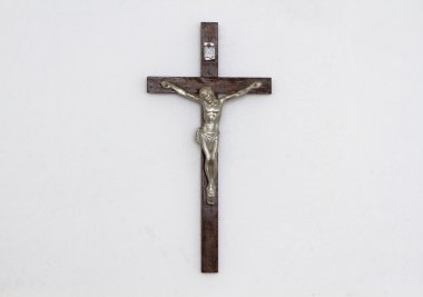 Figurine of crucifixed Jesus on the wall clipart