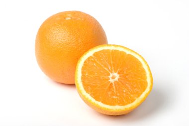 Two oranges, one intersected to half. With clipping path clipart