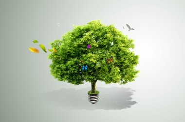 Green tree growing out of a bulb clipart