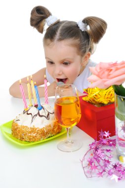 Beautiful little girl celebrates birthday clipart