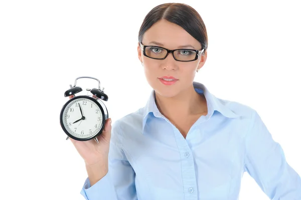 Woman with an alarm clock in a hand. Royalty Free Stock Images
