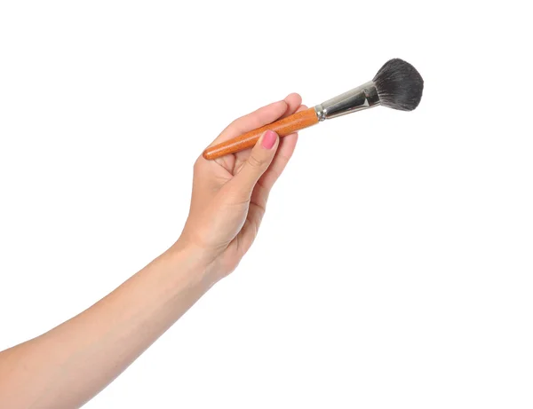 Women hand with a black brush — Stock Photo, Image