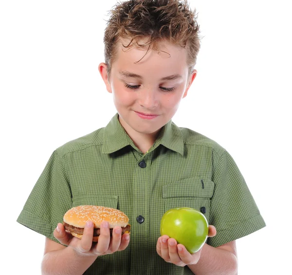 Eszik egy hamburgert kisfiú — Stock Fotó