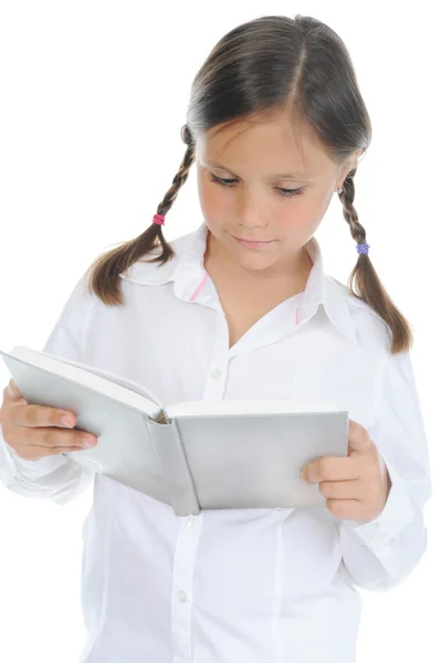 Маленькая девочка держит свою книгу — стоковое фото