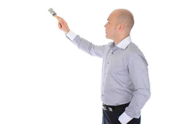 Zakenman met een penseel in zijn hand — Stockfoto