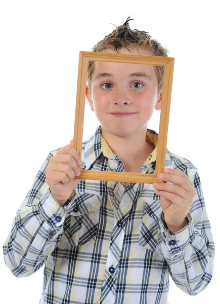 Kleiner Junge mit Rahmen in den Händen — Stockfoto