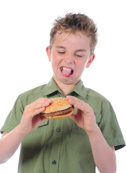 Eszik egy hamburgert kisfiú — Stock Fotó