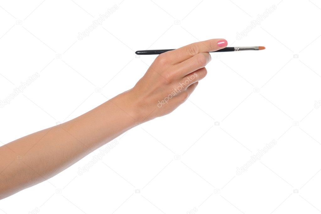 Women hand with a black brush