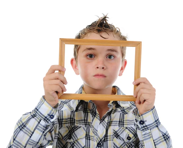 Niño pequeño con un marco en las manos —  Fotos de Stock