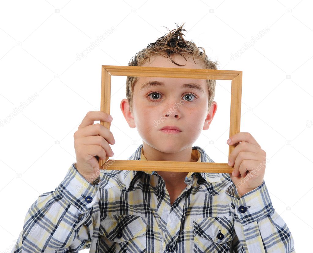 Little boy with a frame in his hands