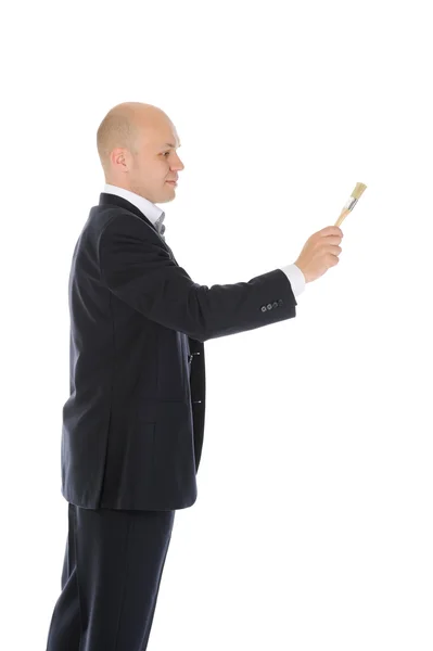 Uomo d'affari con un pennello in mano — Foto Stock
