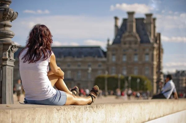 stock image The girl against Louvre