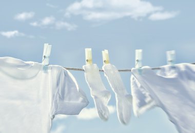 Clothes hanging on clothesline clipart