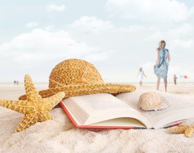 Straw hat , book and seashells in the sand clipart