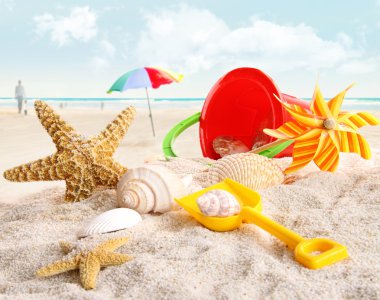 Children's beach toys at the beach clipart