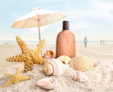 Suntan lotion and seashells on the beach clipart